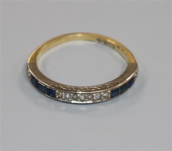 An 18ct gold, diamond and sapphire half eternity ring, size P/Q.